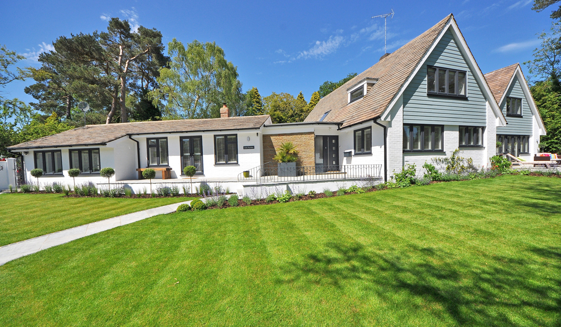 house with a large, healthy lawn