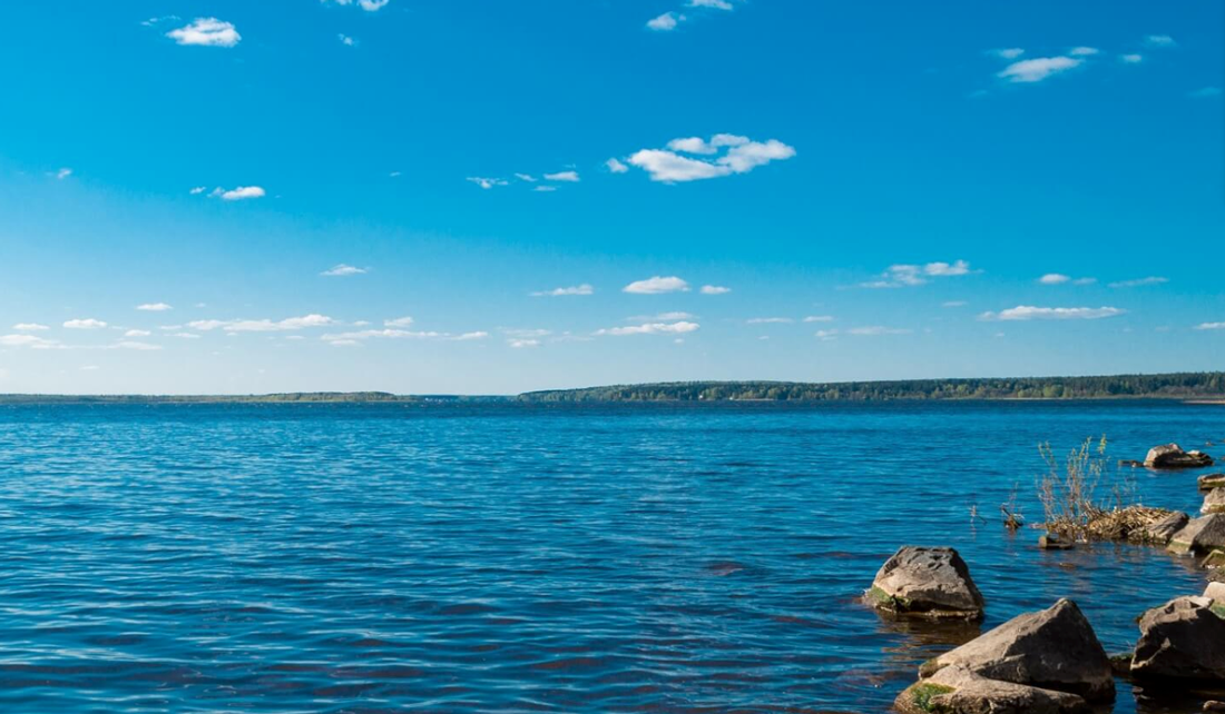 body of water with rocks near shore