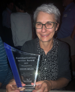 Irene Miles holds the Communications Service Award