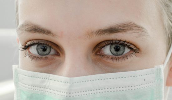 closeup of woman wearing medical facemask