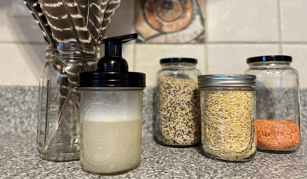 cleaning supplies and dry goods stored in mason jars