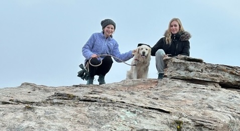 Intern Naomi Michael (right) hiking with friend and dog