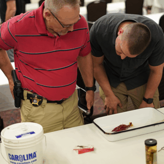Conservation officers looking at crayfish